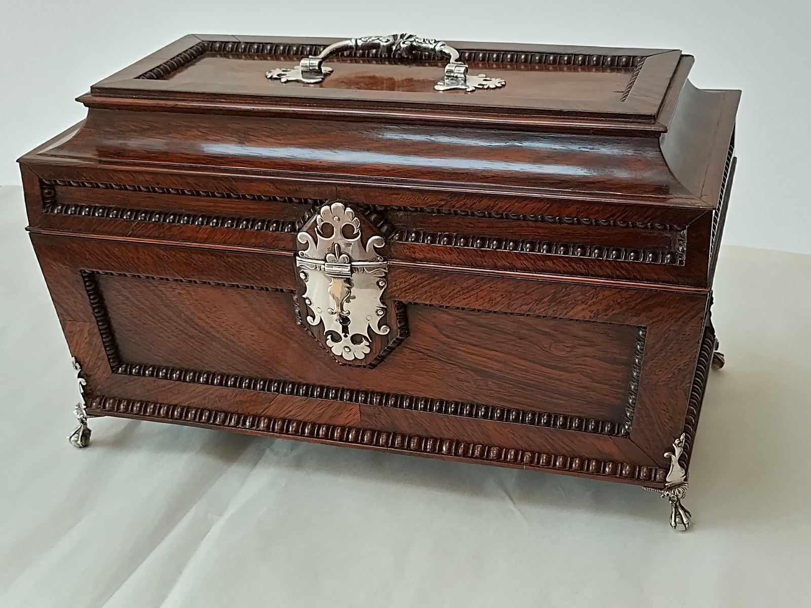 Rosewood caddy conserved after water damage