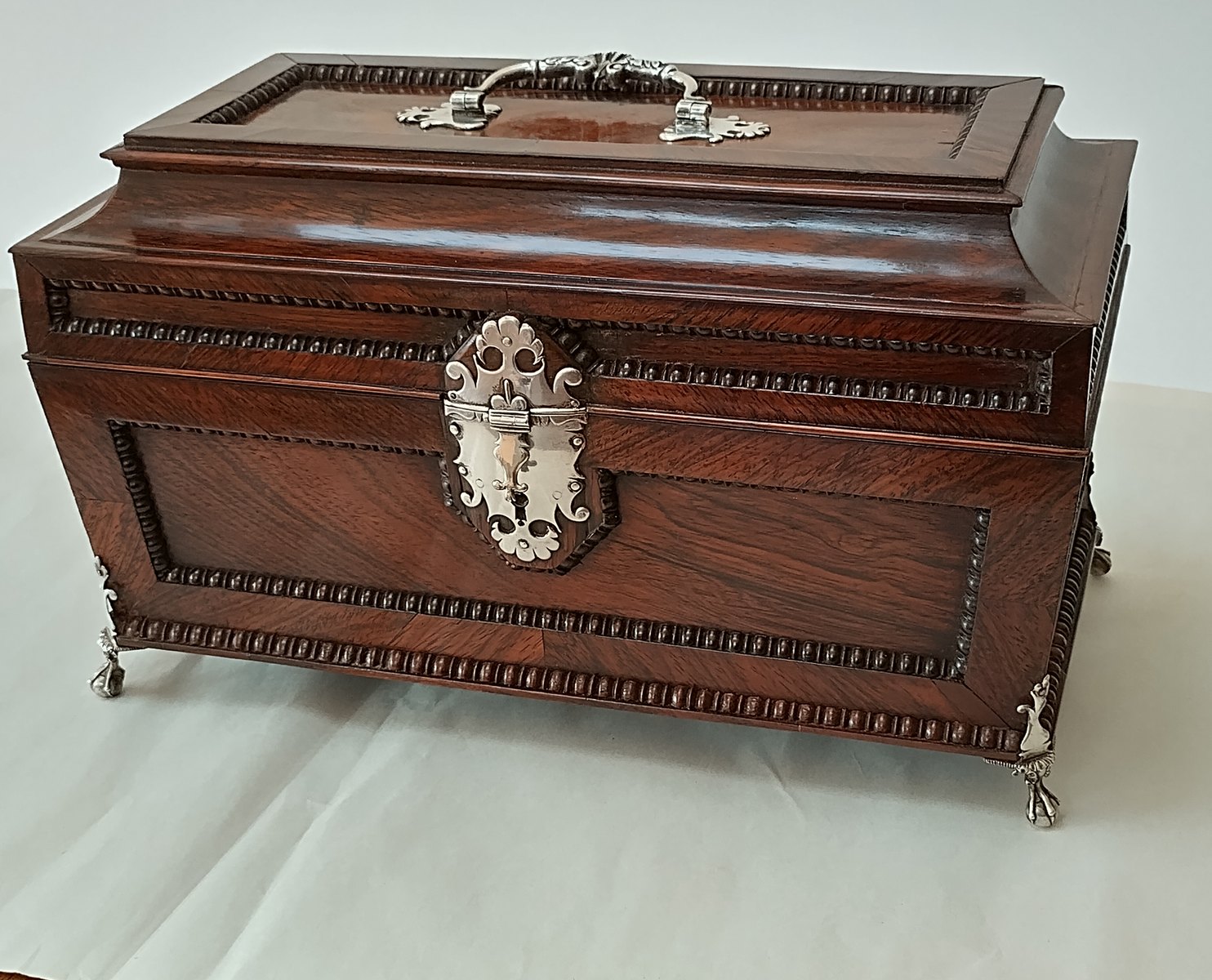 Rosewood caddy on completion of conservation repairs following water damage