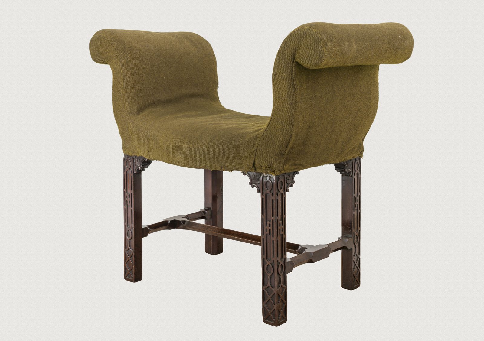 Window seat retaining its earlier green upholstery cover